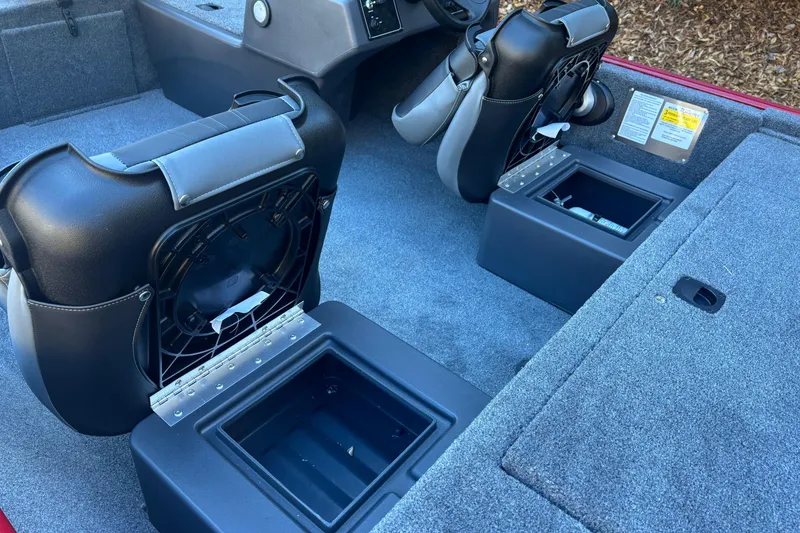 Slide: The Image of 2026 Tracker Bass Tracker Classic XL boat interior with storage compartments and seating. - 8