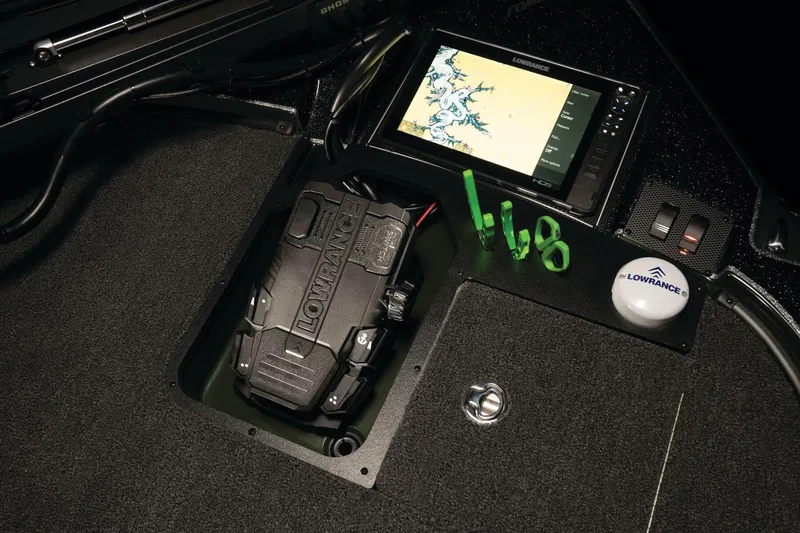 Slide: The Image of Open storage compartment on 2026 Triton 20XP Patriot boat, featuring carpeted interior. - 23