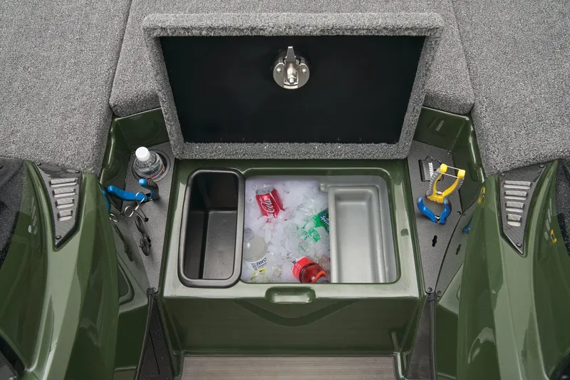 Slide: The Image of 2026 Triton 20XP Patriot boat storage compartments with carpeted lids. - 33