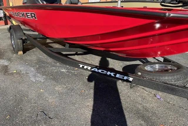 The Image of 2026 Tracker Pro Team 195 boat in vibrant red on a trailer. - 0