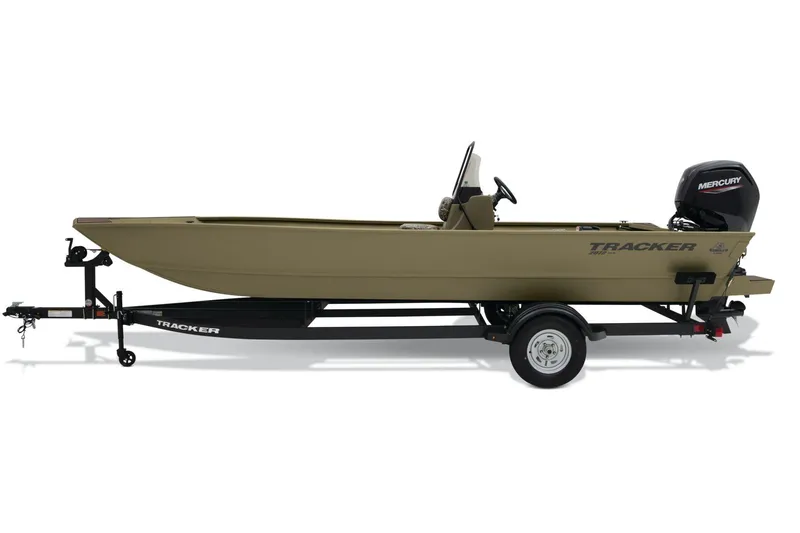 Slide: The Image of 2026 Tracker Grizzly 2072 CC boat interior with camo design and steering console. - 3