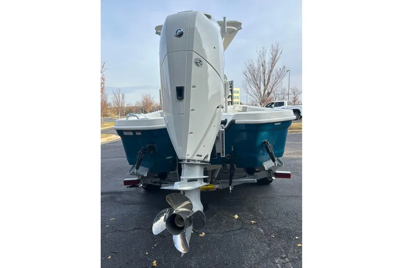 Slide: The Image of 2026 Mako 24 APEX boat rear view with powerful outboard motor. - 4