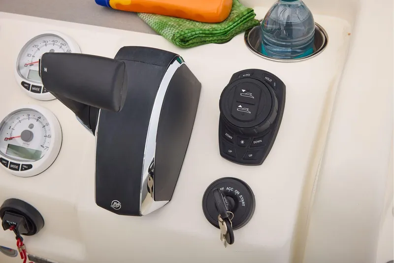 Slide: The Image of Control panel of 2026 Mako 24 APEX boat with throttle and gauges. - 46