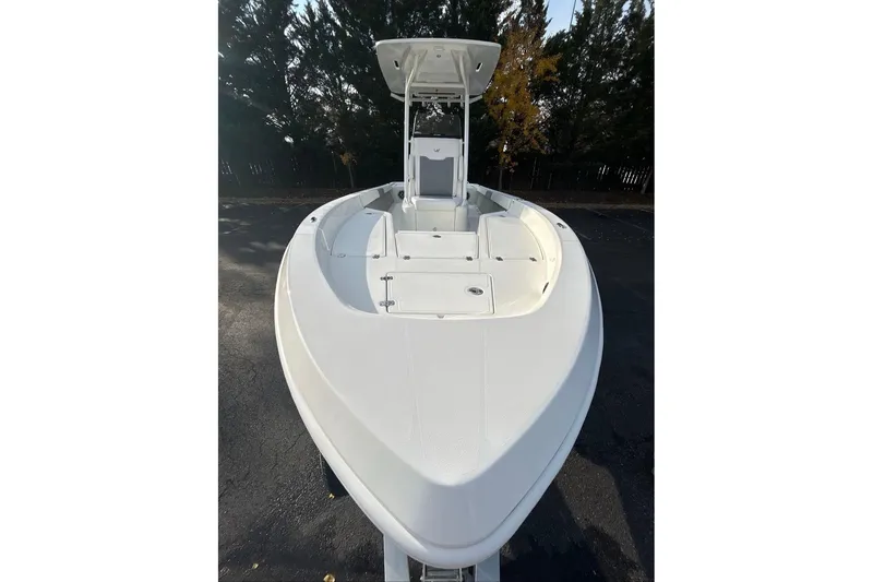 Slide: The Image of 2026 Mako 24 APEX boat with sleek design and spacious deck. - 8