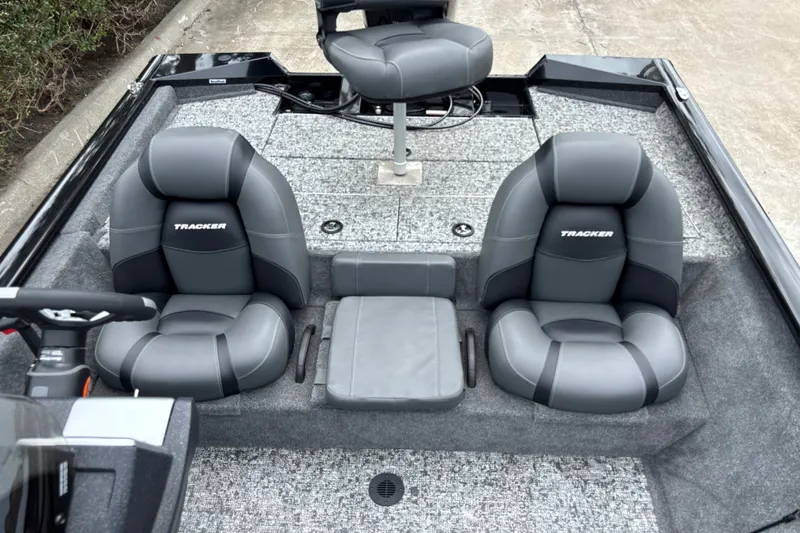 Slide: The Image of 2026 Tracker Pro Team 195 boat interior with gray seating and steering console. - 15
