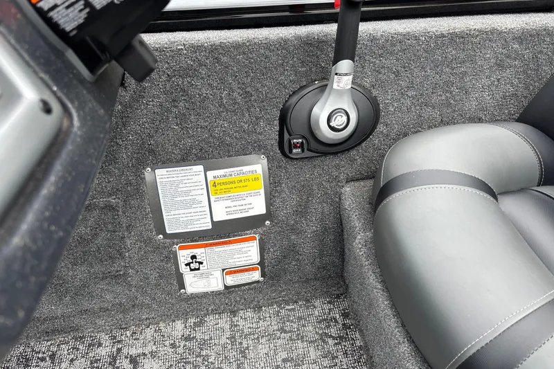 Slide: The Image of Interior of 2026 Tracker Pro Team 195 boat with control panel and seating. - 24