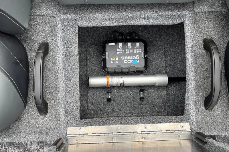 Slide: The Image of Interior of 2026 Tracker Pro Team 195 boat showing storage compartment with equipment. - 23