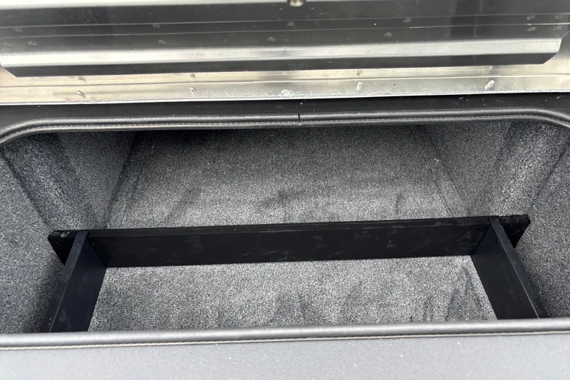 Slide: The Image of Storage compartment of 2026 Tracker Pro Team 195 boat, featuring a spacious interior. - 21
