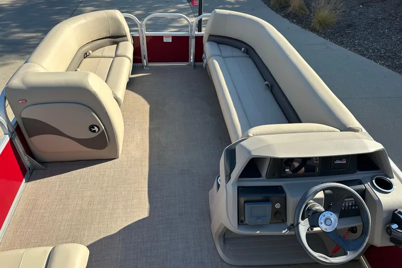 Slide: The Image of 2024 Sun Tracker Party Barge 18 DLX interior with spacious seating and modern helm. - 3