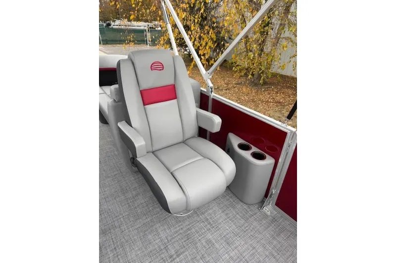 Slide: The Image of Luxurious seating on 2026 Sun Tracker Party Barge 22 DLX with cup holders and stylish design. - 13