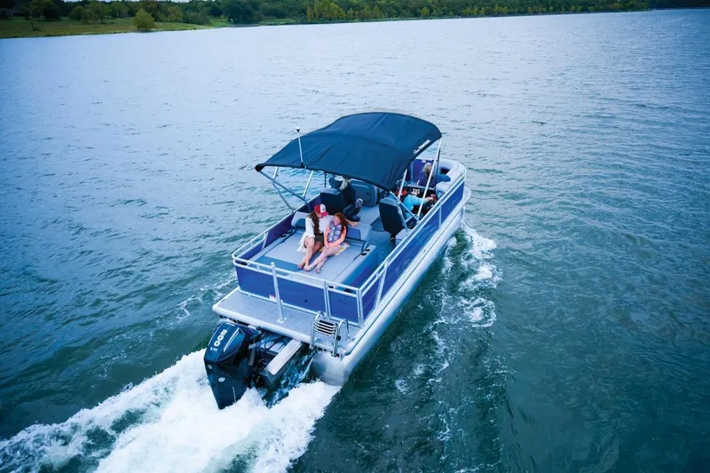 Slide: The Image of 2026 Sun Tracker Party Barge 22 RF XP3 cruising on a serene lake. - 12