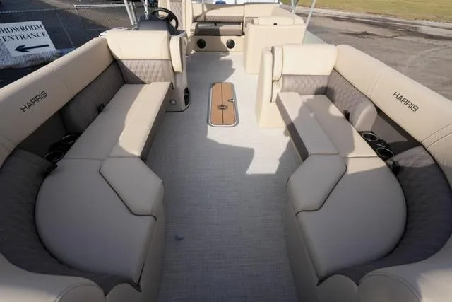 Slide: The Image of 2026 Harris Cruiser 230 pontoon boat interior with beige seating and modern design. - 11