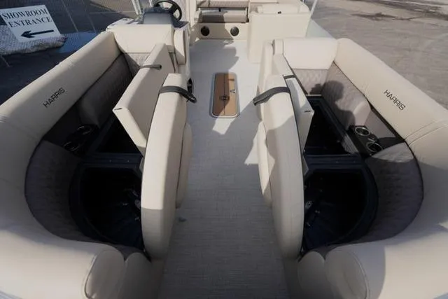 Slide: The Image of 2026 Harris Cruiser 230 interior with beige seating and cup holders. - 12