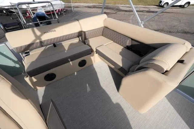 Slide: The Image of 2026 Harris Cruiser 230 boat interior with beige seating and modern design. - 15