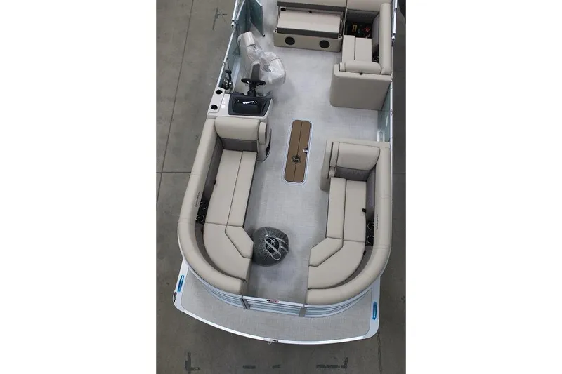 Slide: The Image of 2026 Harris Cruiser 230 pontoon boat interior with beige seating and steering console. - 2