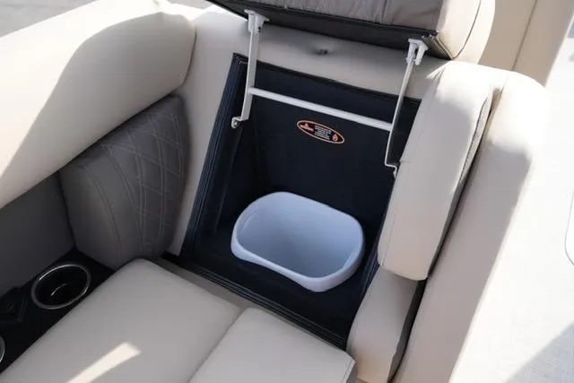 Slide: The Image of 2026 Harris Cruiser 230 boat seat with built-in storage compartment and trash bin. - 21