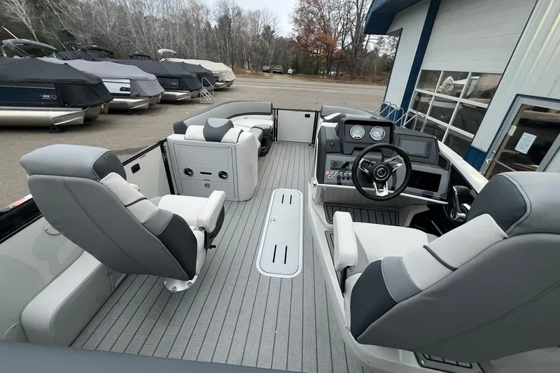 Slide: The Image of 2026 Avalon Catalina Versatile Rear Lounger boat interior with modern seating and controls. - 17
