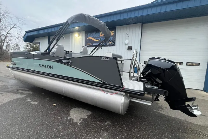 Slide: The Image of 2026 Avalon Catalina Versatile Rear Lounger pontoon boat with Mercury outboard motor. - 2