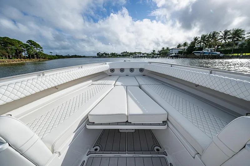 Slide: The Image of Luxurious 2023 HCB 53 Sueños boat interior with plush seating and scenic water view. - 3