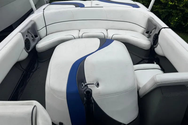 Slide: The Image of 2004 Nautique Air Nautique 216 boat interior with white and blue seating. - 10