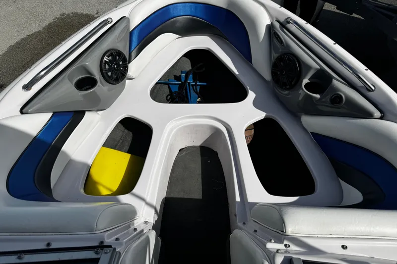 Slide: The Image of 2004 Nautique Air Nautique 216 boat interior with blue and white seating. - 14