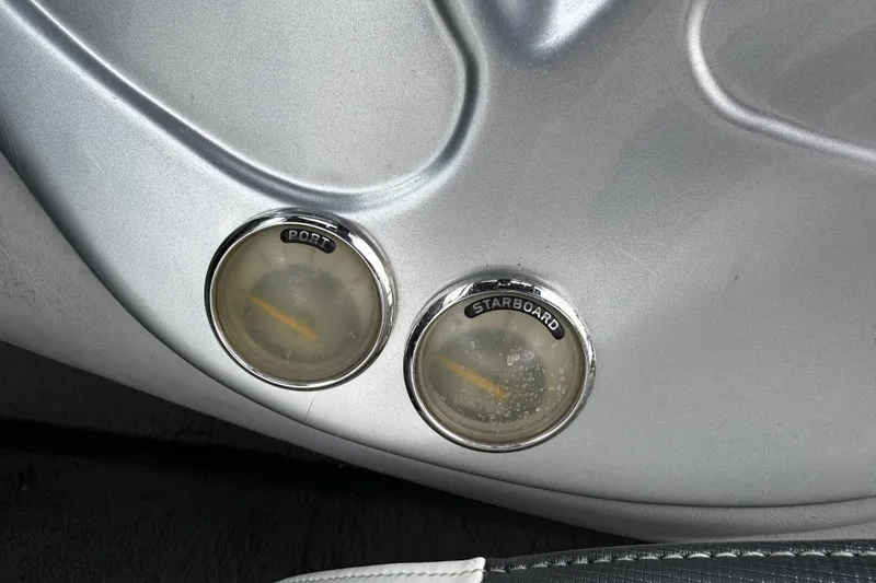 Slide: The Image of 2004 Nautique Air Nautique 216 dashboard with port and starboard gauges. - 8