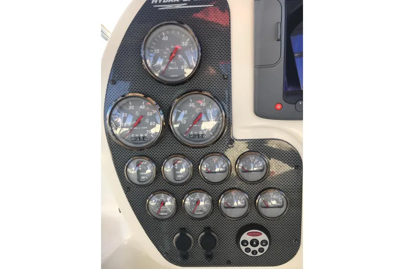 Slide: The Image of Dashboard of 2006 Hydra-Sports Vector 2900 VX with multiple gauges and controls. - 12
