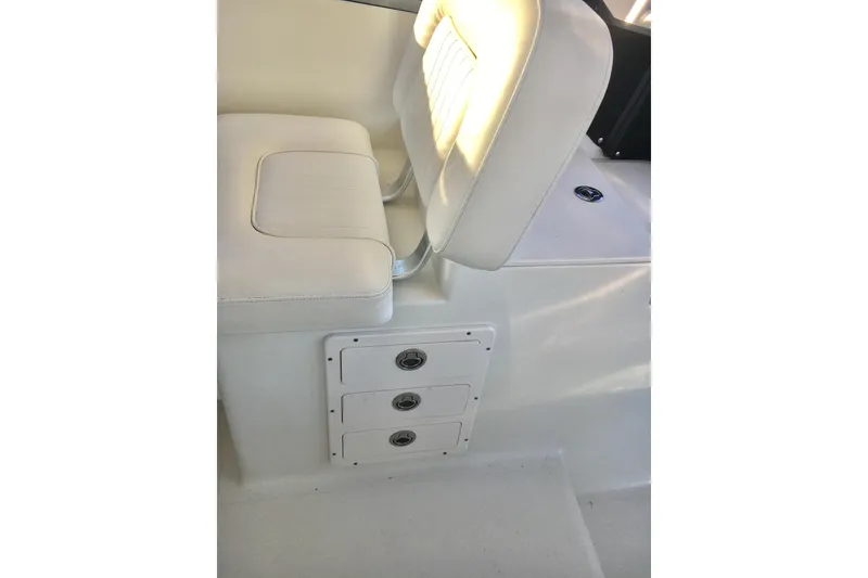 Slide: The Image of 2006 Hydra-Sports Vector 2900 VX boat interior with white seating and storage compartments. - 16