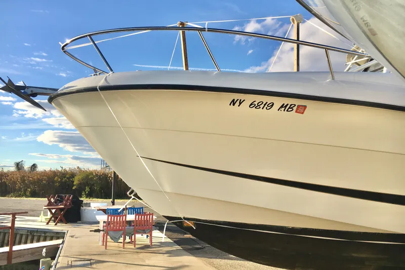 Slide: The Image of 2006 Hydra-Sports Vector 2900 VX boat docked under clear blue sky. - 2
