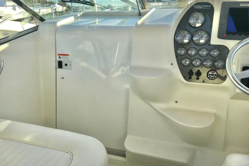 Slide: The Image of 2006 Hydra-Sports Vector 2900 VX helm with gauges and steering wheel. - 21