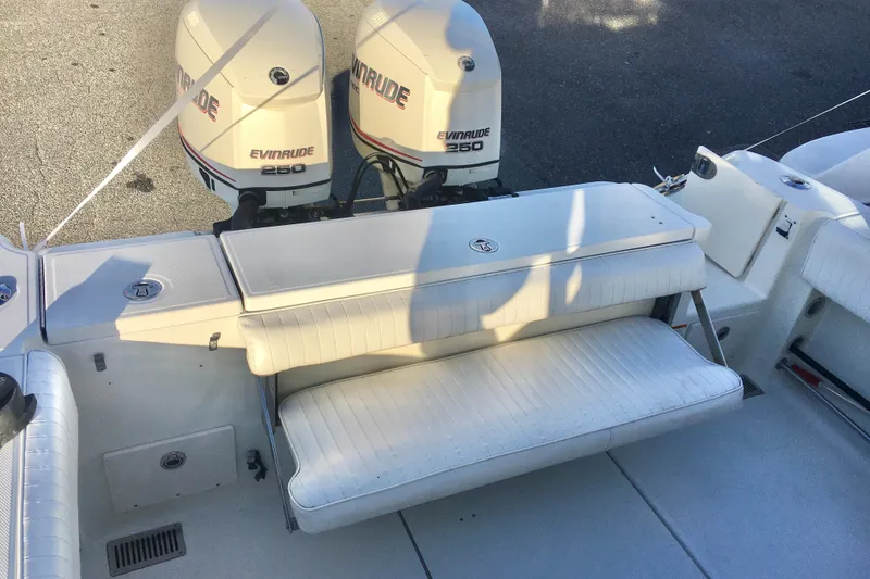 Slide: The Image of 2006 Hydra-Sports Vector 2900 VX boat with twin Evinrude 250 engines and white seating. - 24
