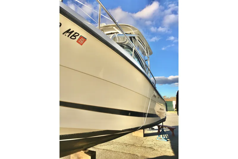 Slide: The Image of 2006 Hydra-Sports Vector 2900 VX boat on stands under a clear blue sky. - 3