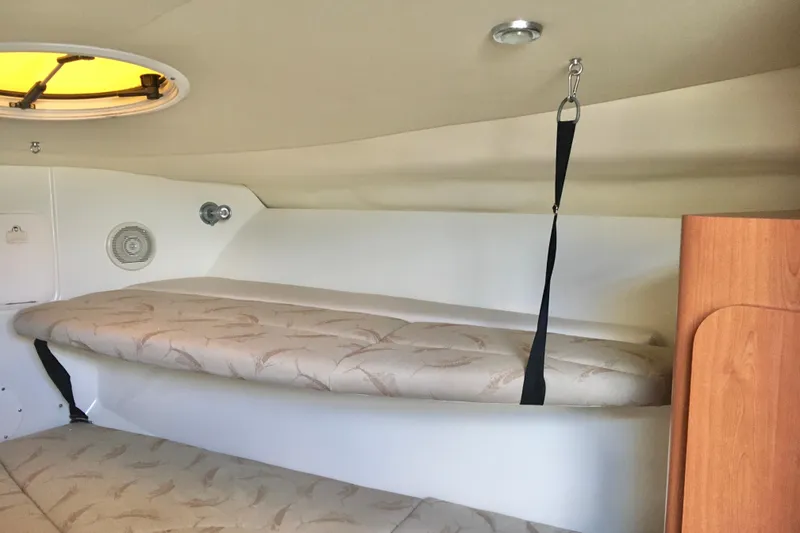 Slide: The Image of 2006 Hydra-Sports Vector 2900 VX cabin interior with cushioned seating and ceiling hatch. - 32