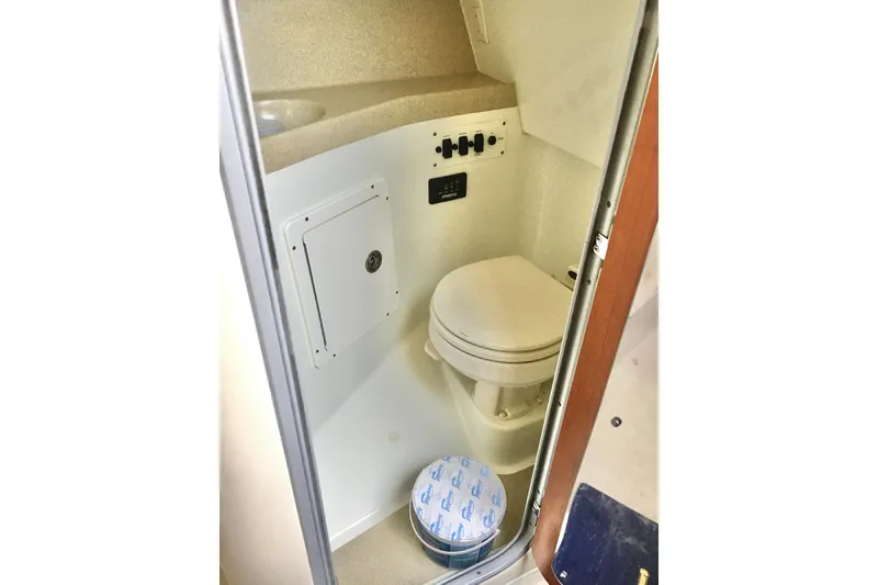 Slide: The Image of 2006 Hydra-Sports Vector 2900 VX boat bathroom interior with toilet and control panel. - 36