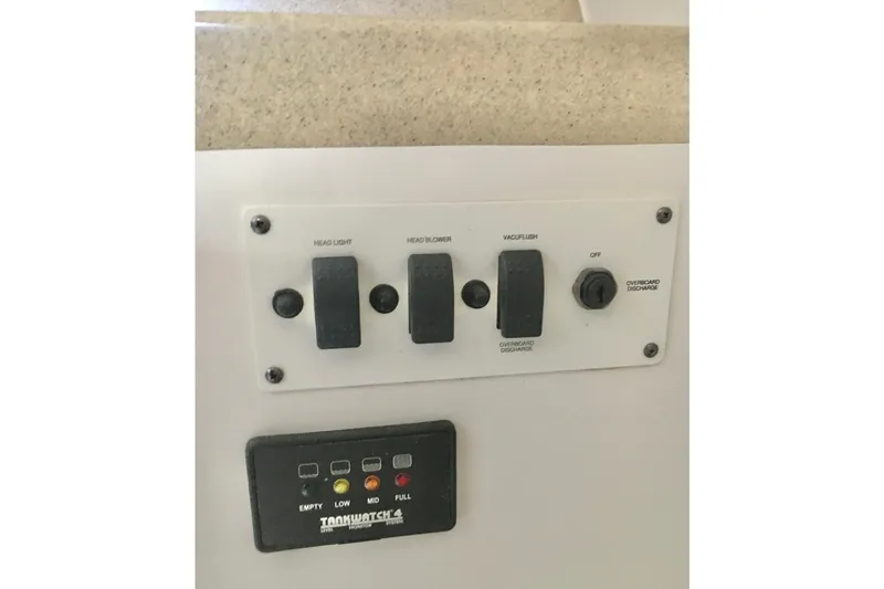 Slide: The Image of Control panel of 2006 Hydra-Sports Vector 2900 VX boat with switches and tank monitor. - 38