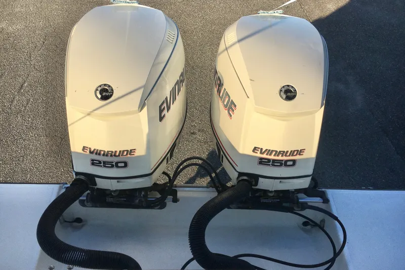 Slide: The Image of Twin Evinrude 250 outboard engines on a 2006 Hydra-Sports Vector 2900 VX boat. - 5