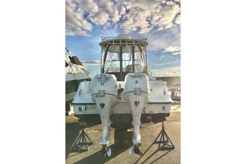 Slide: The Image of 2006 Hydra-Sports Vector 2900 VX boat with dual outboard motors on stands. - 9