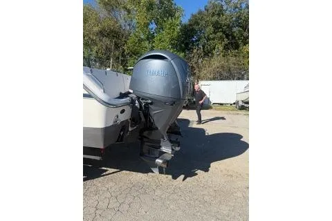 Slide: The Image of 2011 Grady-White Freedom 275 boat with Yamaha outboard motor in a sunny outdoor setting. - 2