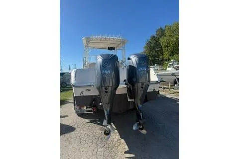 Slide: The Image of 2011 Grady-White Freedom 275 boat with twin Yamaha 200 engines, parked outdoors. - 6