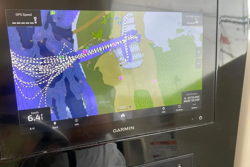 Slide: The Image of Garmin marine GPS display on 2021 Pursuit OS 355 Offshore, showing nautical chart and depth. - 18