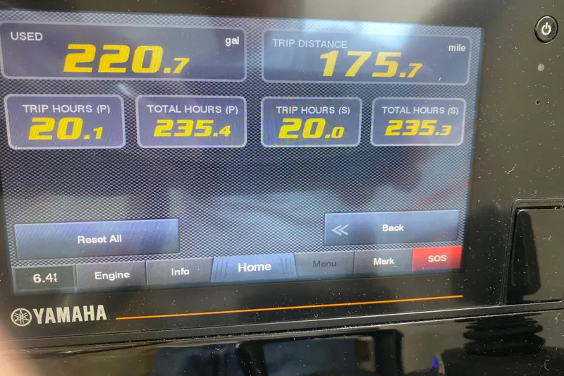 Slide: The Image of Dashboard display of a 2021 Pursuit OS 355 Offshore boat showing fuel and trip data. - 19