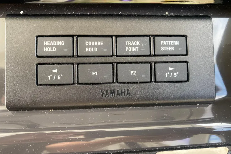 Slide: The Image of Control panel of a 2021 Pursuit OS 355 Offshore boat with Yamaha buttons. - 21