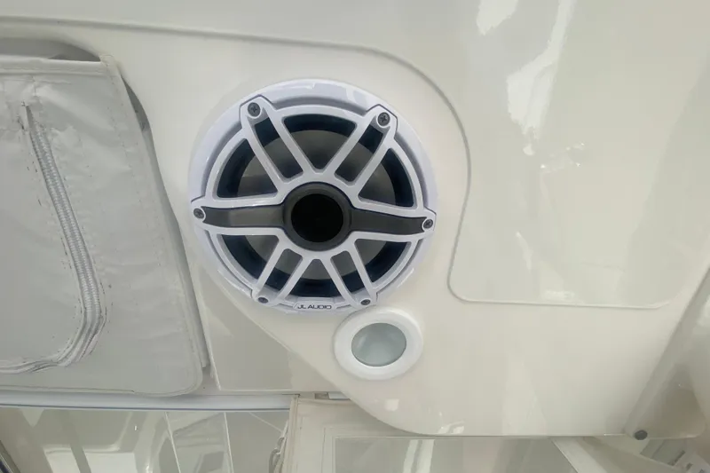 Slide: The Image of JL Audio speaker on 2021 Pursuit OS 355 Offshore boat interior. - 27
