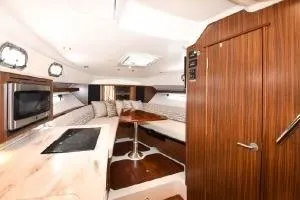 Slide: The Image of 2021 Pursuit OS 355 Offshore yacht interior with modern kitchen and seating area. - 46