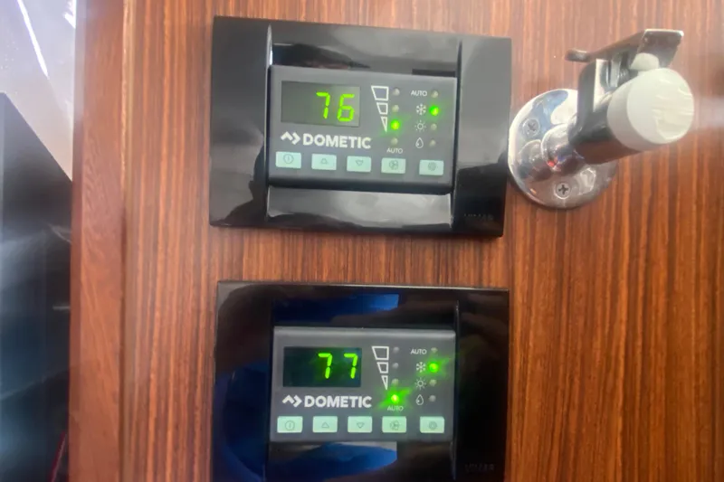 Slide: The Image of Dometic control panels on 2021 Pursuit OS 355 Offshore boat, displaying temperatures. - 47