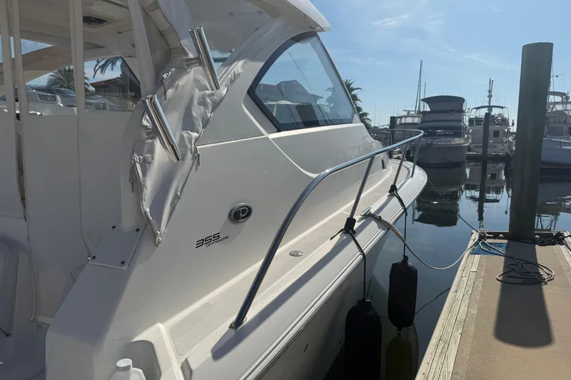 Slide: The Image of 2021 Pursuit OS 355 Offshore yacht docked at marina, side view. - 54