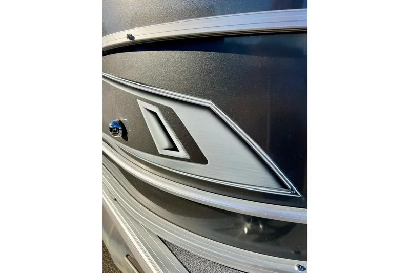 Slide: The Image of 2021 SMOKERCRAFT EX20C boat cleat on textured deck surface. - 13