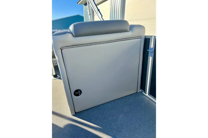 Slide: The Image of 2021 SMOKERCRAFT EX20C boat interior with seating and storage compartment. - 29