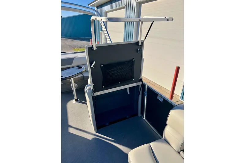 Slide: The Image of 2021 SMOKERCRAFT EX20C boat interior with steering console and seating. - 30
