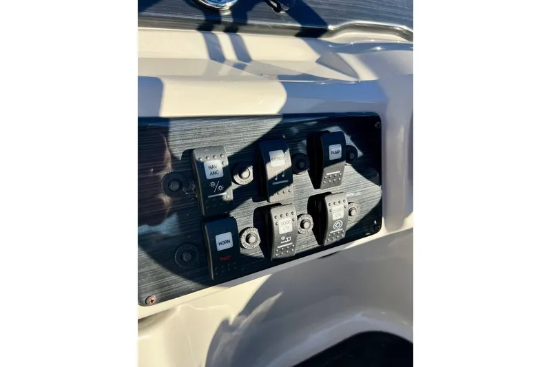 Slide: The Image of Dashboard of 2021 SMOKERCRAFT EX20C boat with speedometer and voltmeter. - 33